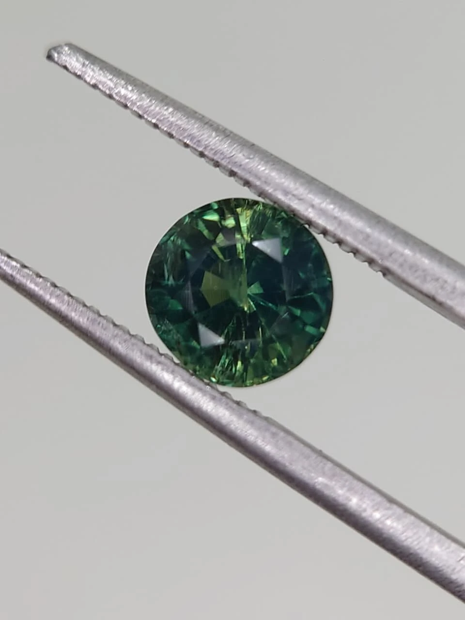 1.3ct Bluish Green Natural Round Faceted Sapphire from Nigeria — view 1